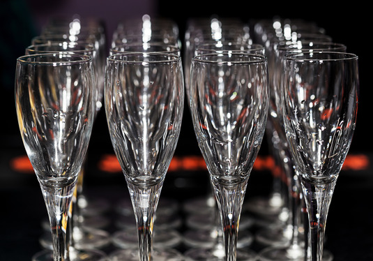 row of empty champagne glasses for nice party